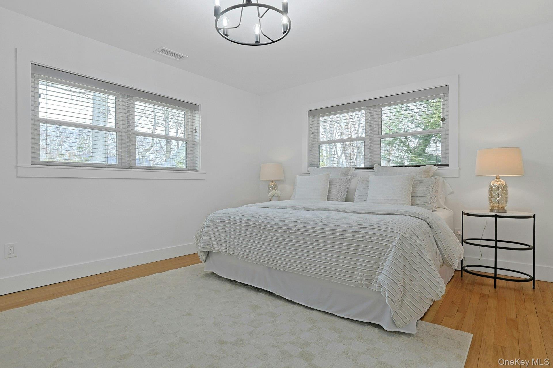 73 Bon Air Avenue New Rochelle, NY 10804 - Photo 11 of 23 a bedroom with a bed and a window