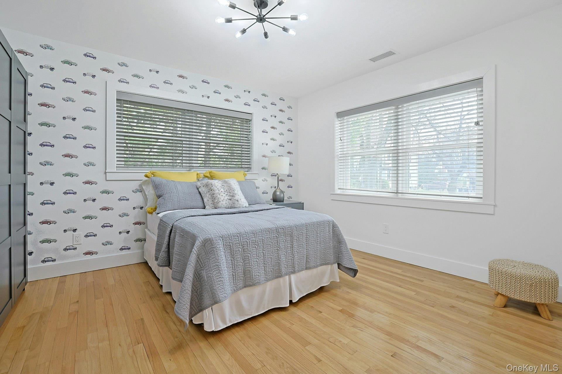 73 Bon Air Avenue New Rochelle, NY 10804 - Photo 13 of 23 a spacious bedroom with a bed and a window