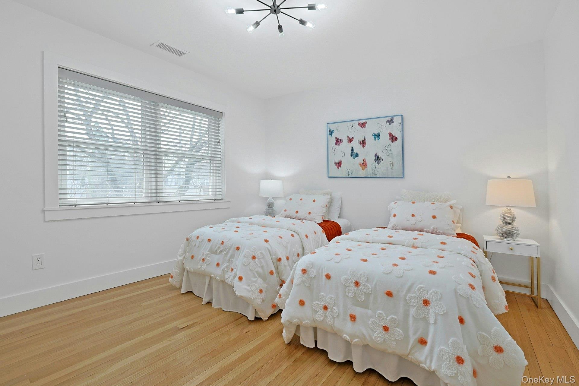 73 Bon Air Avenue New Rochelle, NY 10804 - Photo 14 of 23 a bedroom with two beds and a window