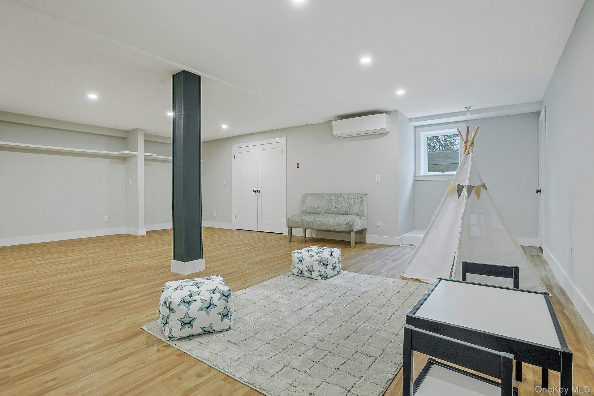 73 Bon Air Avenue New Rochelle, NY 10804 - Photo 18 of 23 a room with furniture and wooden floor