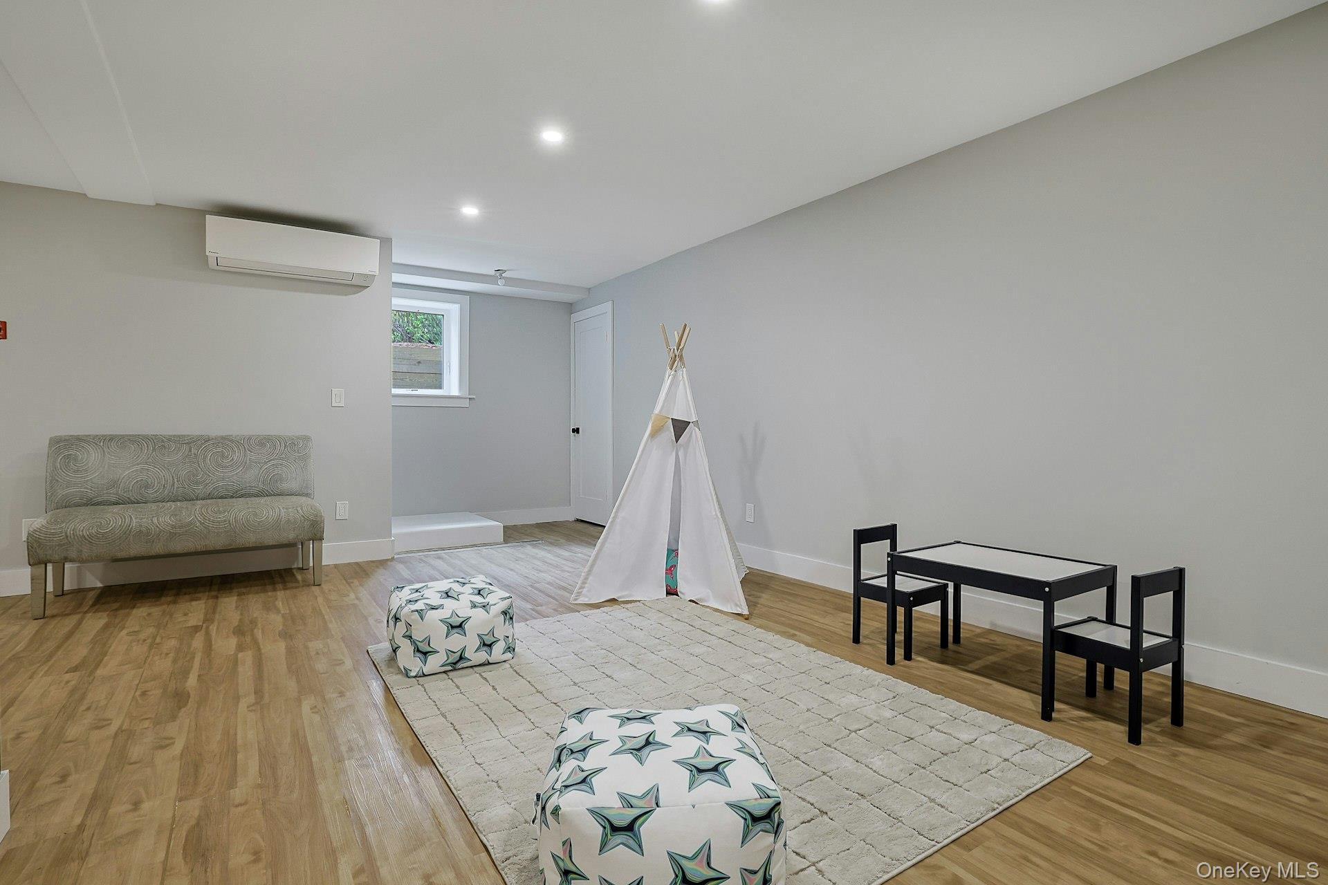 73 Bon Air Avenue New Rochelle, NY 10804 - Photo 19 of 23 a bedroom with a bed and a couch