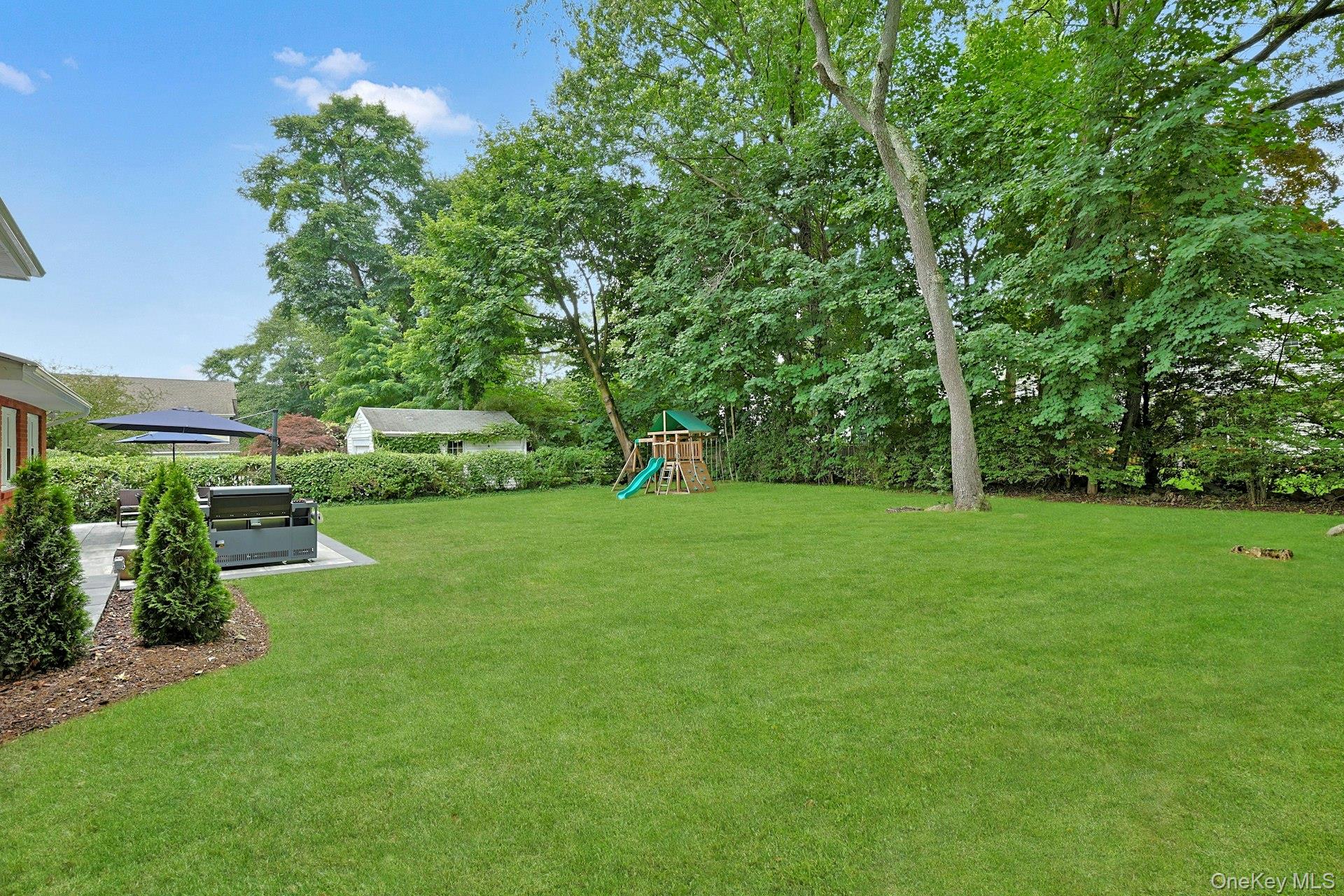 73 Bon Air Avenue New Rochelle, NY 10804 - Photo 22 of 23 a view of a backyard with a garden