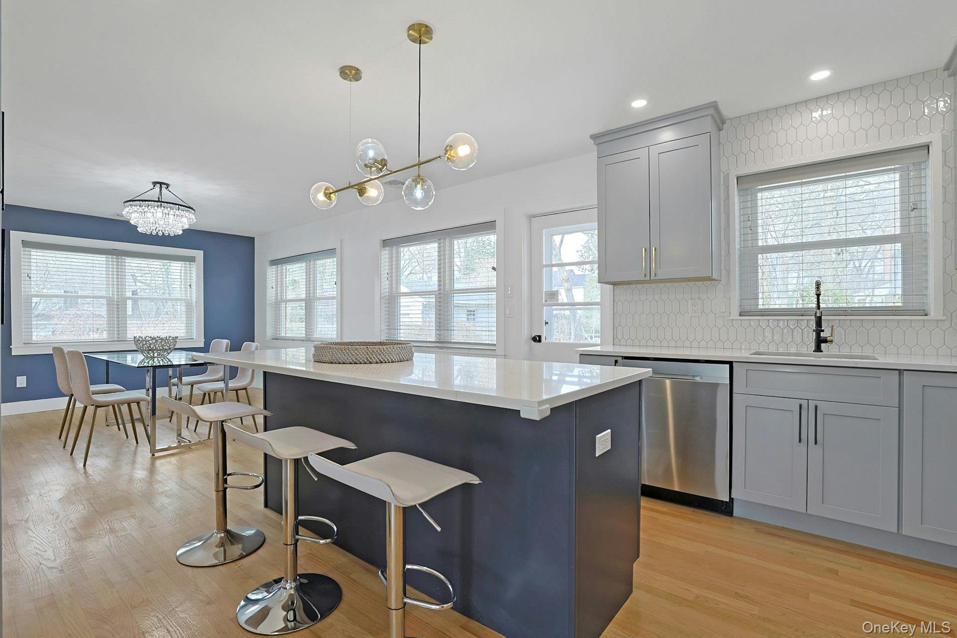 73 Bon Air Avenue New Rochelle, NY 10804 - Photo 9 of 23 a kitchen with counter space dining table and chairs