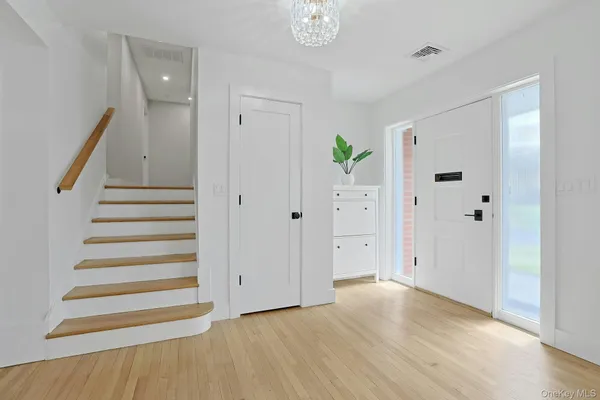 a view of entryway with wooden floor
