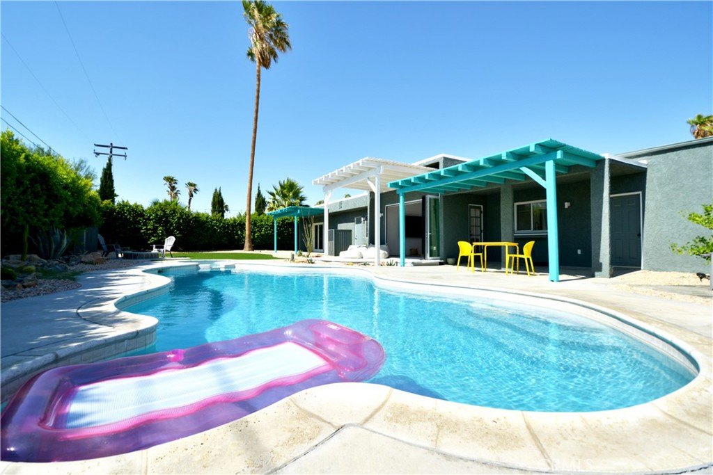 2375 North San Antonio Road Palm Springs, CA 92262 - Photo 1 of 36 a view of a swimming pool with a patio