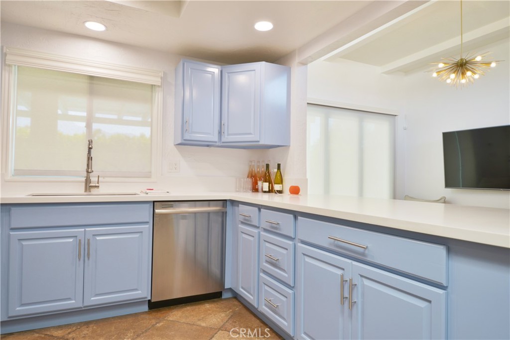 2375 North San Antonio Road Palm Springs, CA 92262 - Photo 11 of 36 a kitchen with white cabinets and sink
