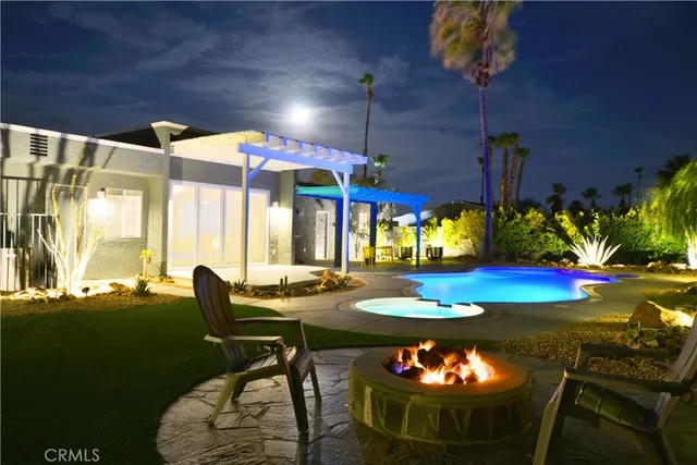 a view of a swimming pool with an outdoor space