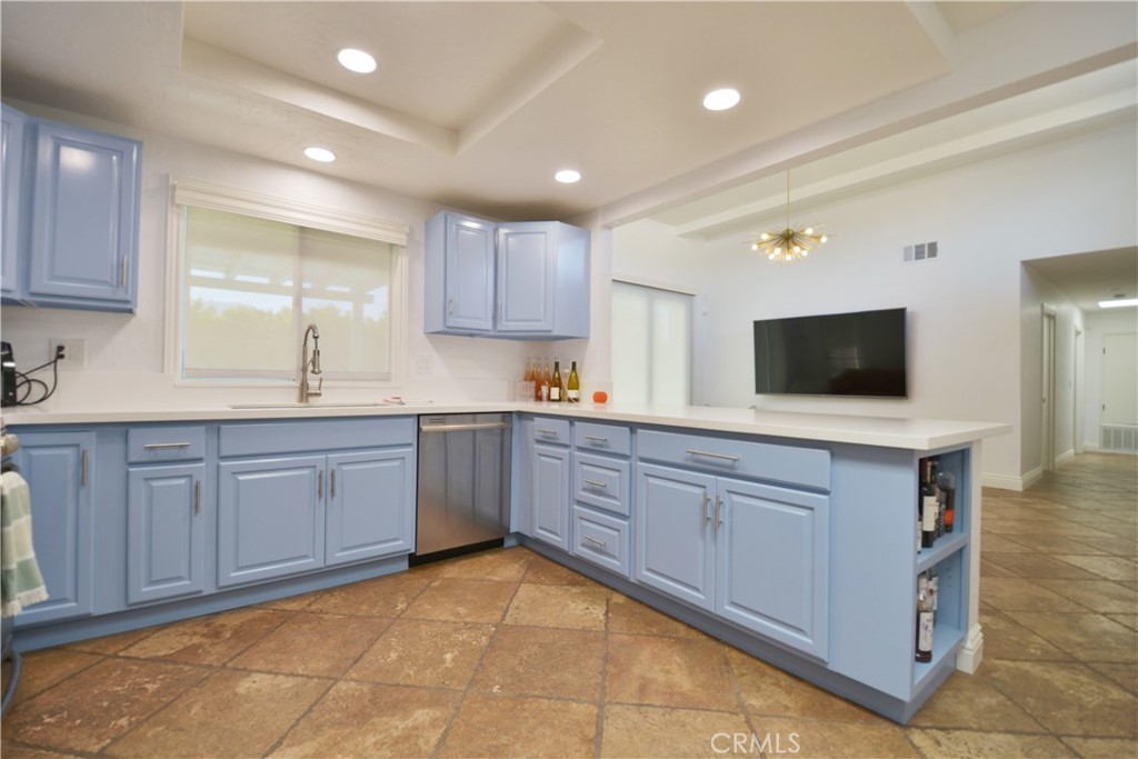 2375 North San Antonio Road Palm Springs, CA 92262 - Photo 4 of 36 a kitchen with stainless steel appliances granite countertop a stove a sink and a refrigerator