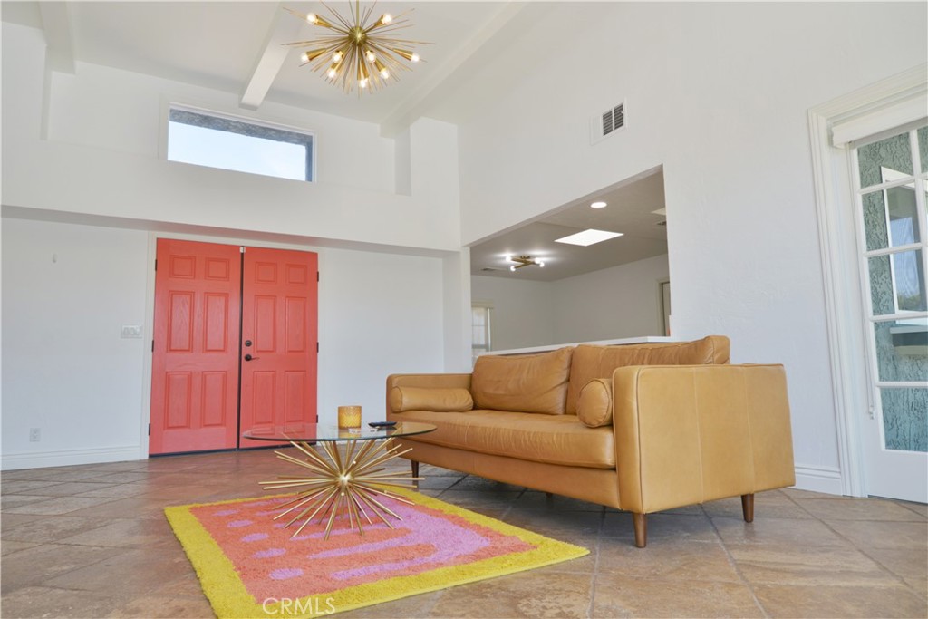 2375 North San Antonio Road Palm Springs, CA 92262 - Photo 5 of 36 a living room with furniture and a rug