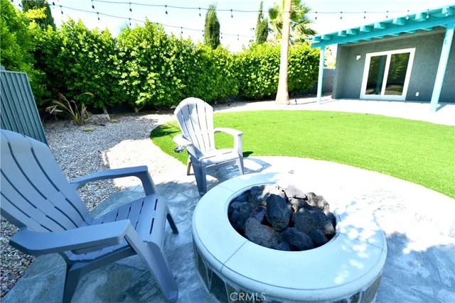 a view of a swimming pool in a backyard