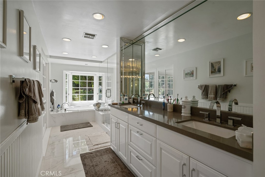 4420 Conchita Way Tarzana, CA 91356 - Photo 11 of 53 a large white kitchen with a large window