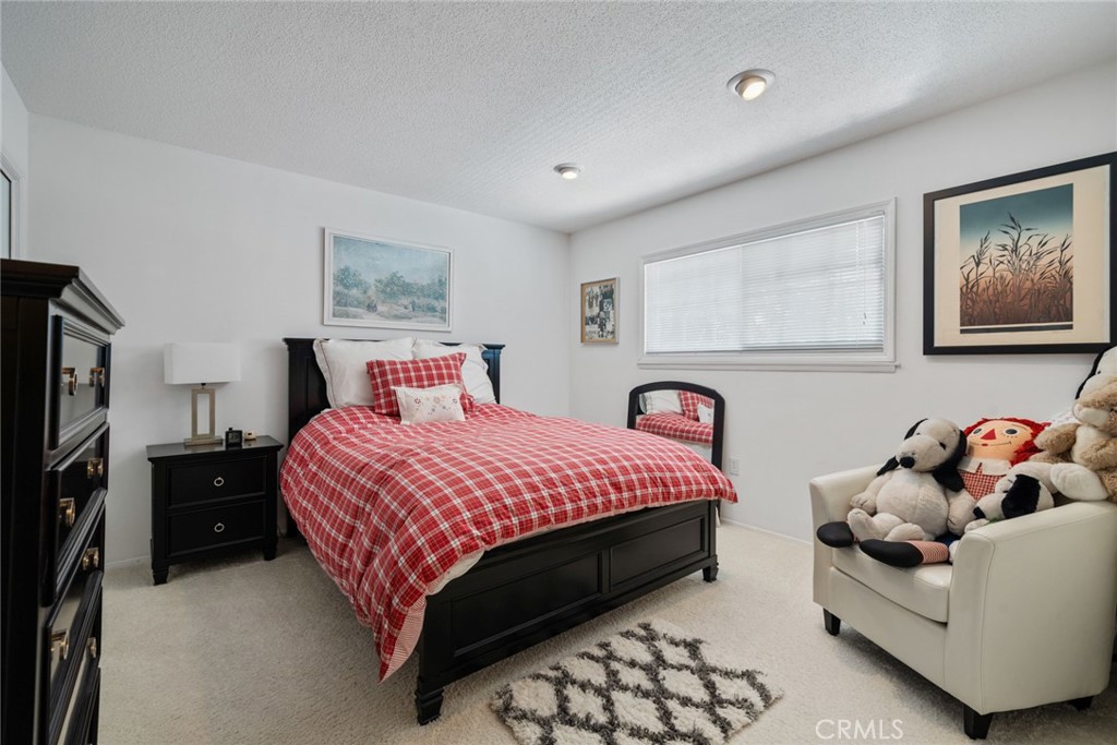 4420 Conchita Way Tarzana, CA 91356 - Photo 14 of 53 a bedroom with bed and a night stand