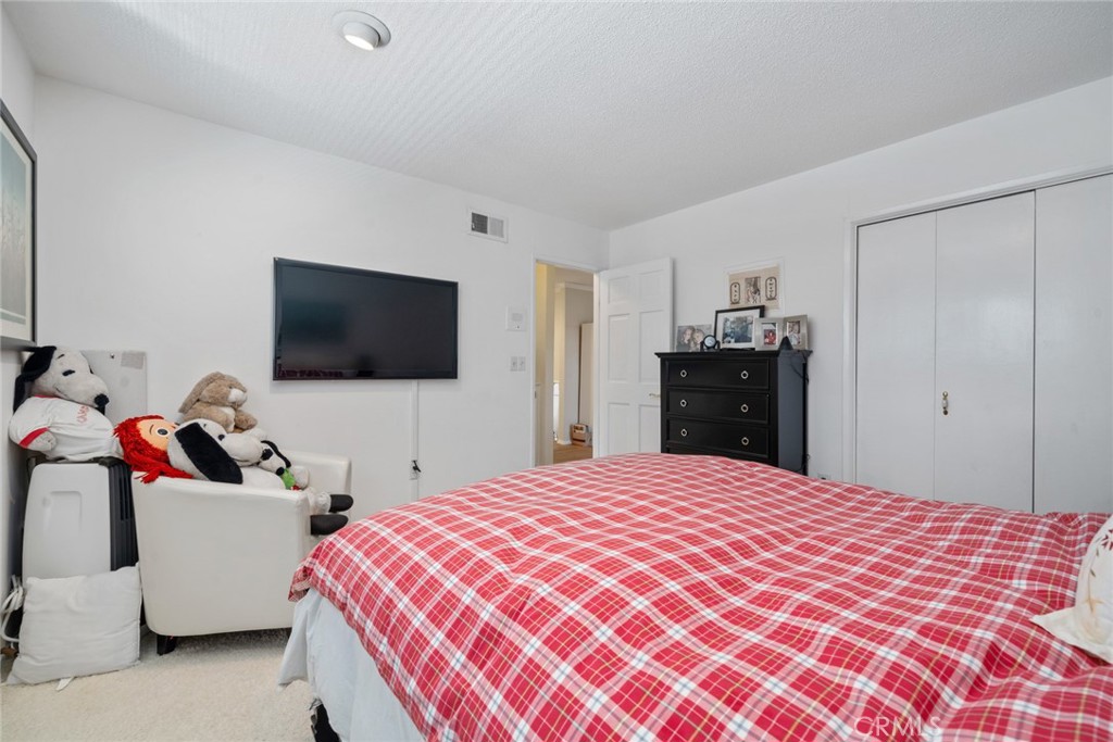 4420 Conchita Way Tarzana, CA 91356 - Photo 15 of 53 a bedroom with a bed and a flat screen tv