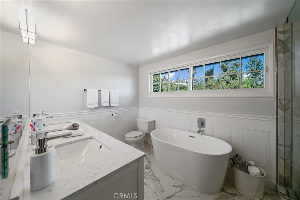 4420 Conchita Way Tarzana, CA 91356 - Photo 16 of 53 a bathroom with a sink and a mirror
