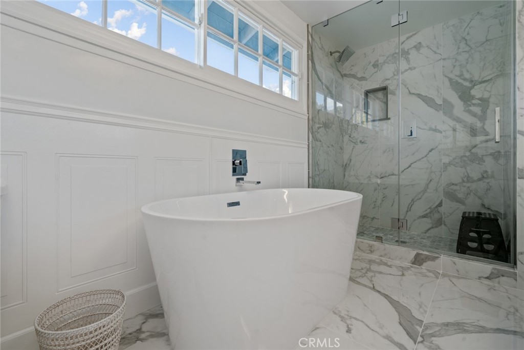 4420 Conchita Way Tarzana, CA 91356 - Photo 19 of 53 a white bath tub sitting next to a toilet