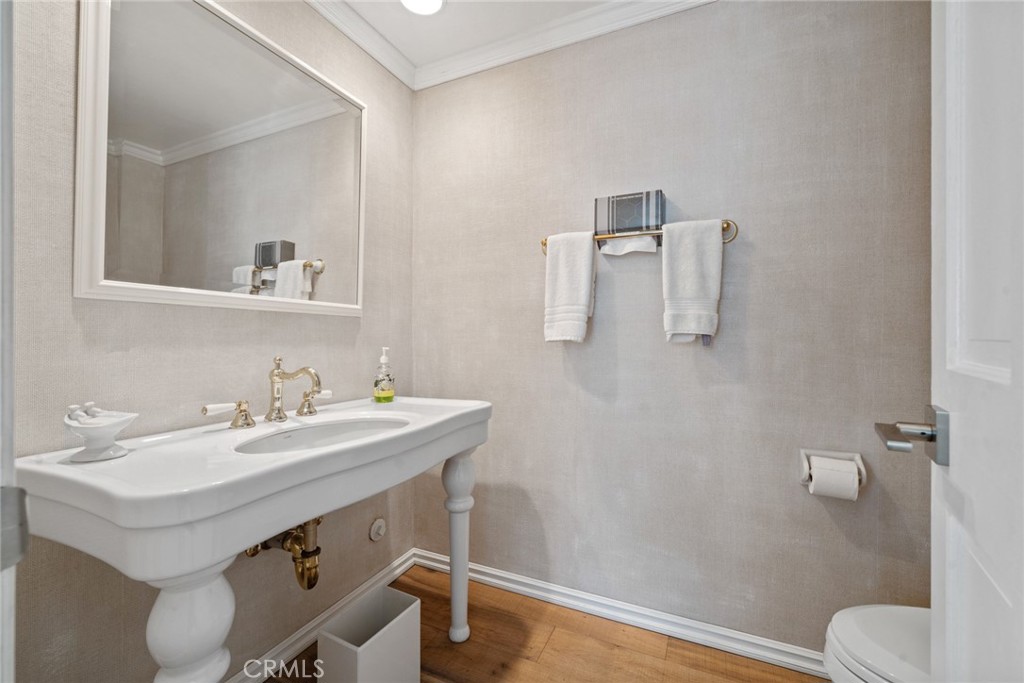 4420 Conchita Way Tarzana, CA 91356 - Photo 26 of 53 a bathroom with a sink toilet and mirror