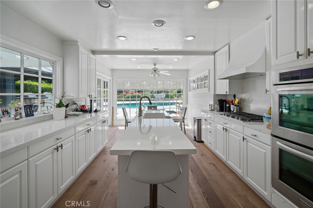 4420 Conchita Way Tarzana, CA 91356 - Photo 28 of 53 a large kitchen with sink and cabinets