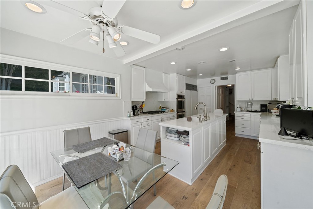 4420 Conchita Way Tarzana, CA 91356 - Photo 31 of 53 a living room with stainless steel appliances kitchen island granite countertop furniture and a view of kitchen