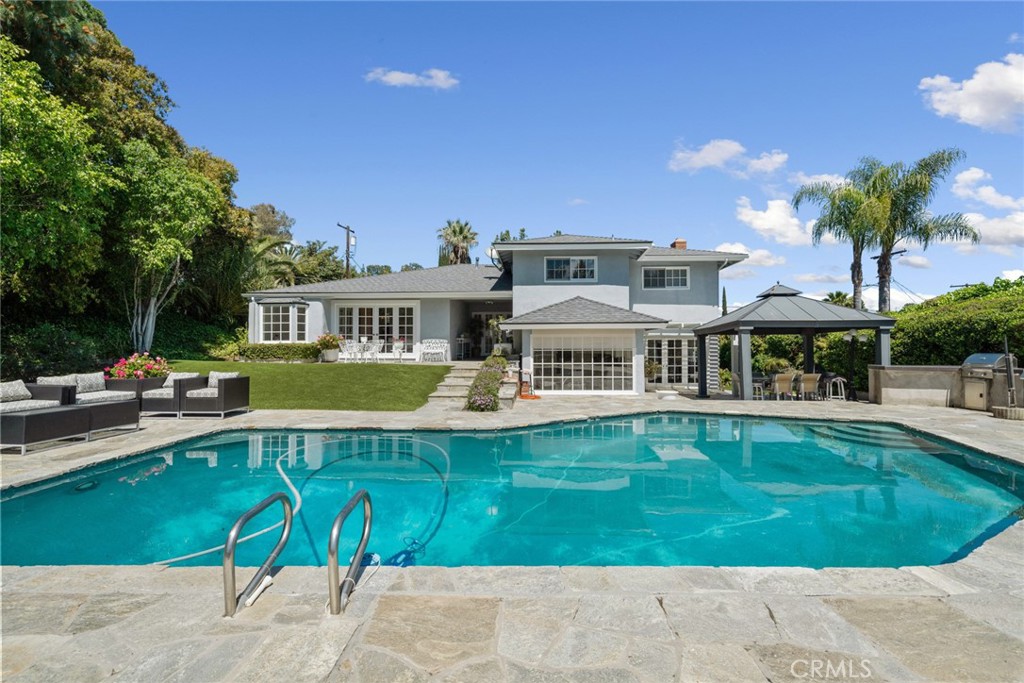 4420 Conchita Way Tarzana, CA 91356 - Photo 38 of 53 a view of a house with a swimming pool
