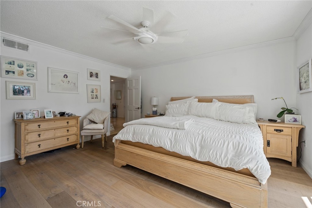 4420 Conchita Way Tarzana, CA 91356 - Photo 8 of 53 a spacious bedroom with a bed and a dresser