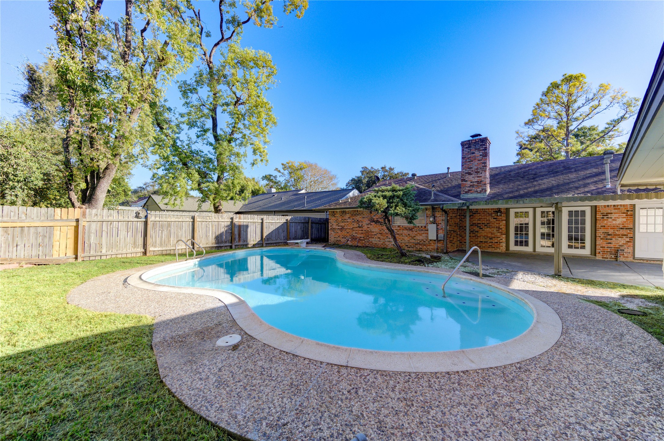 8826 Rowan Lane Houston, TX 77036 - Photo 26 of 26 a view of a house with swimming pool
