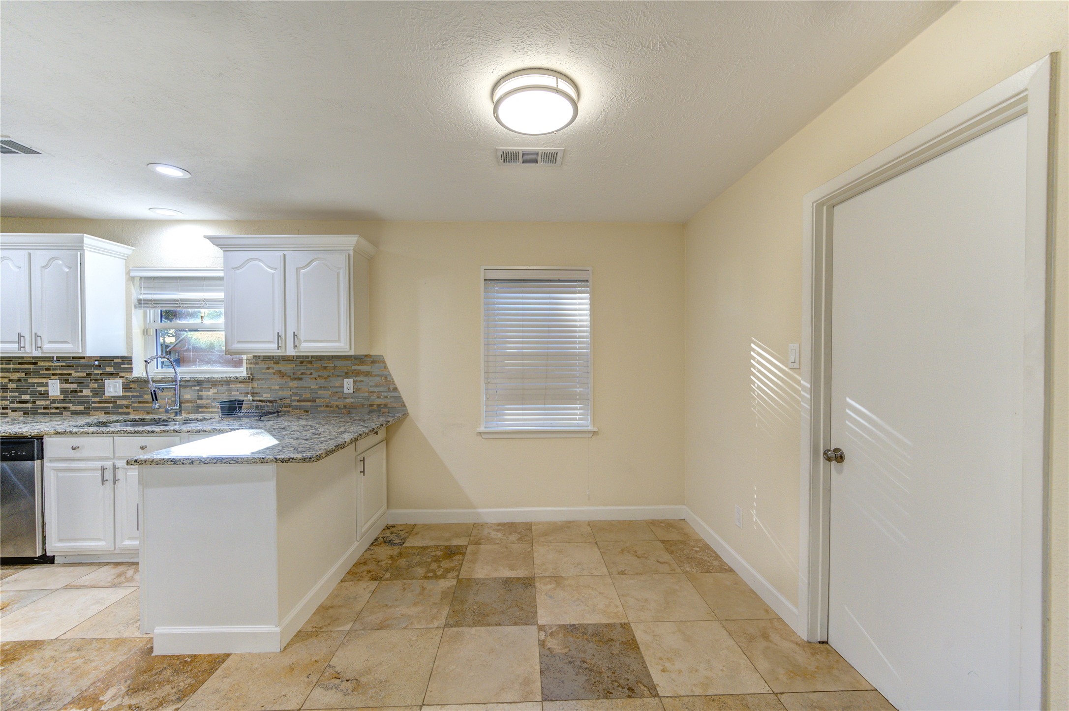 8826 Rowan Lane Houston, TX 77036 - Photo 7 of 26 a kitchen with a sink and cabinets