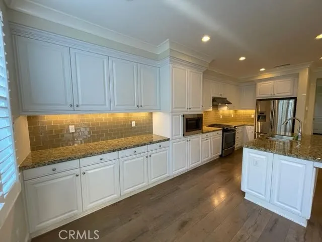 a large kitchen with cabinets