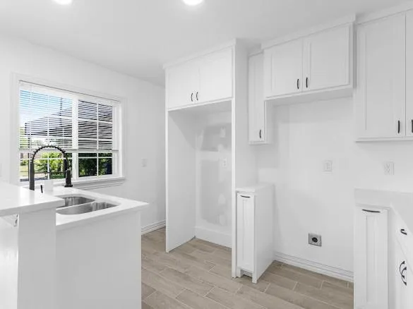 a view of a patio with a table and chairs under an umbrella