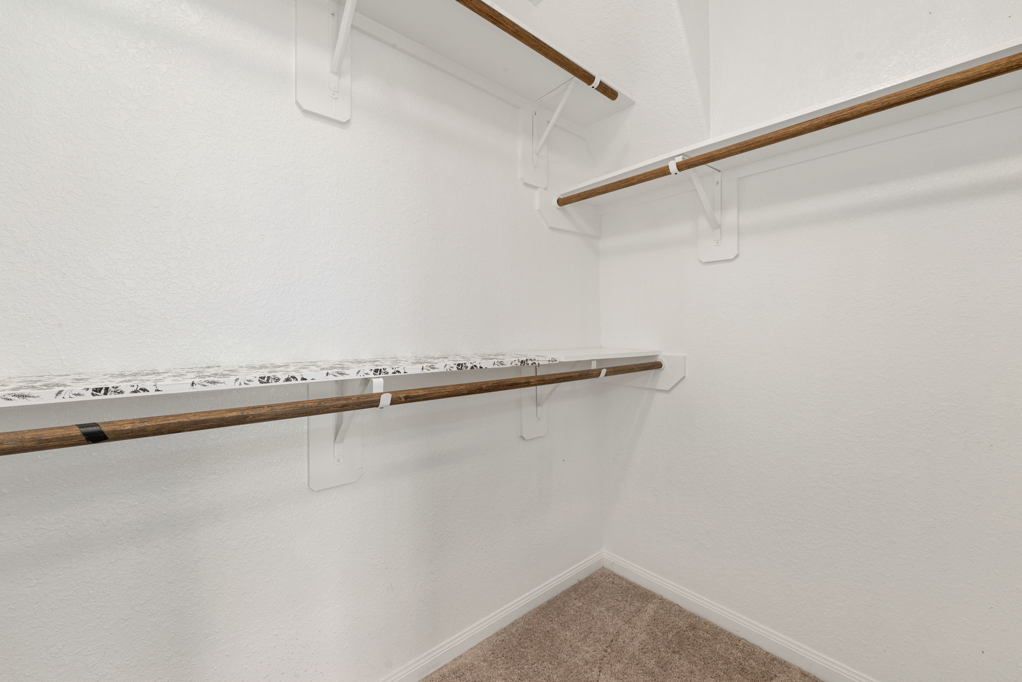 17555 Greystanes Road Humble, TX 77346 - Photo 16 of 28 a view of a room with racks on the wall