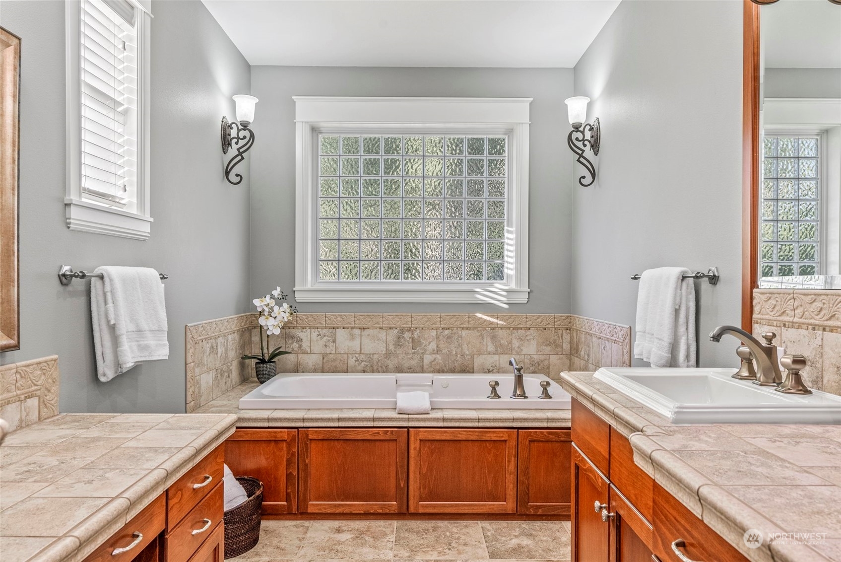 19501 Northwest Krieger Road Ridgefield, WA 98642 - Photo 17 of 38 a kitchen with granite countertop a sink and a stove