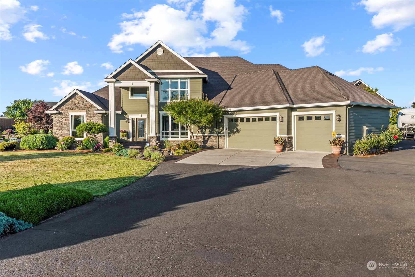 19501 Northwest Krieger Road Ridgefield, WA 98642 - Photo 2 of 38 a front view of a house with a yard