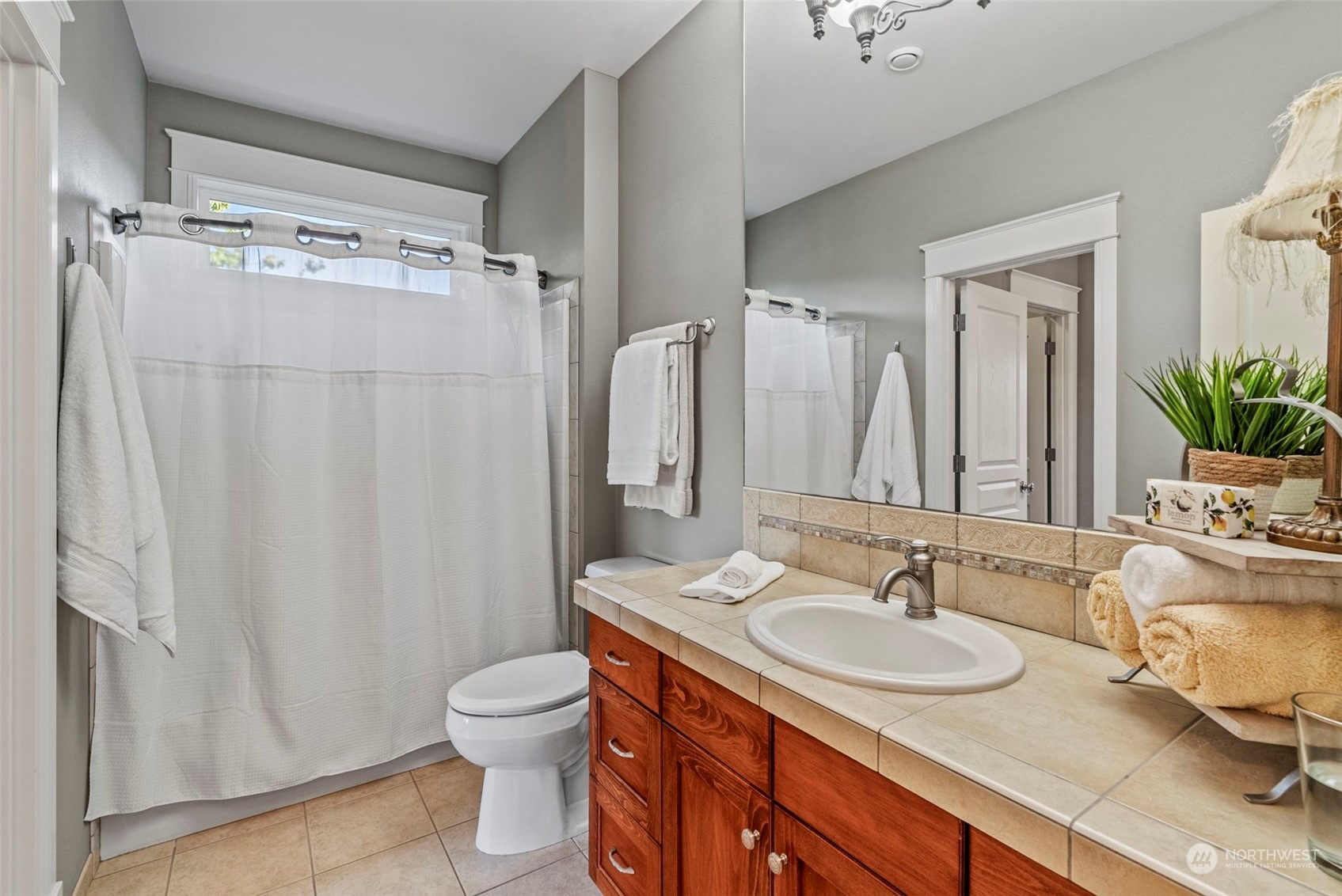 19501 Northwest Krieger Road Ridgefield, WA 98642 - Photo 23 of 38 a bathroom with a granite countertop sink toilet and shower