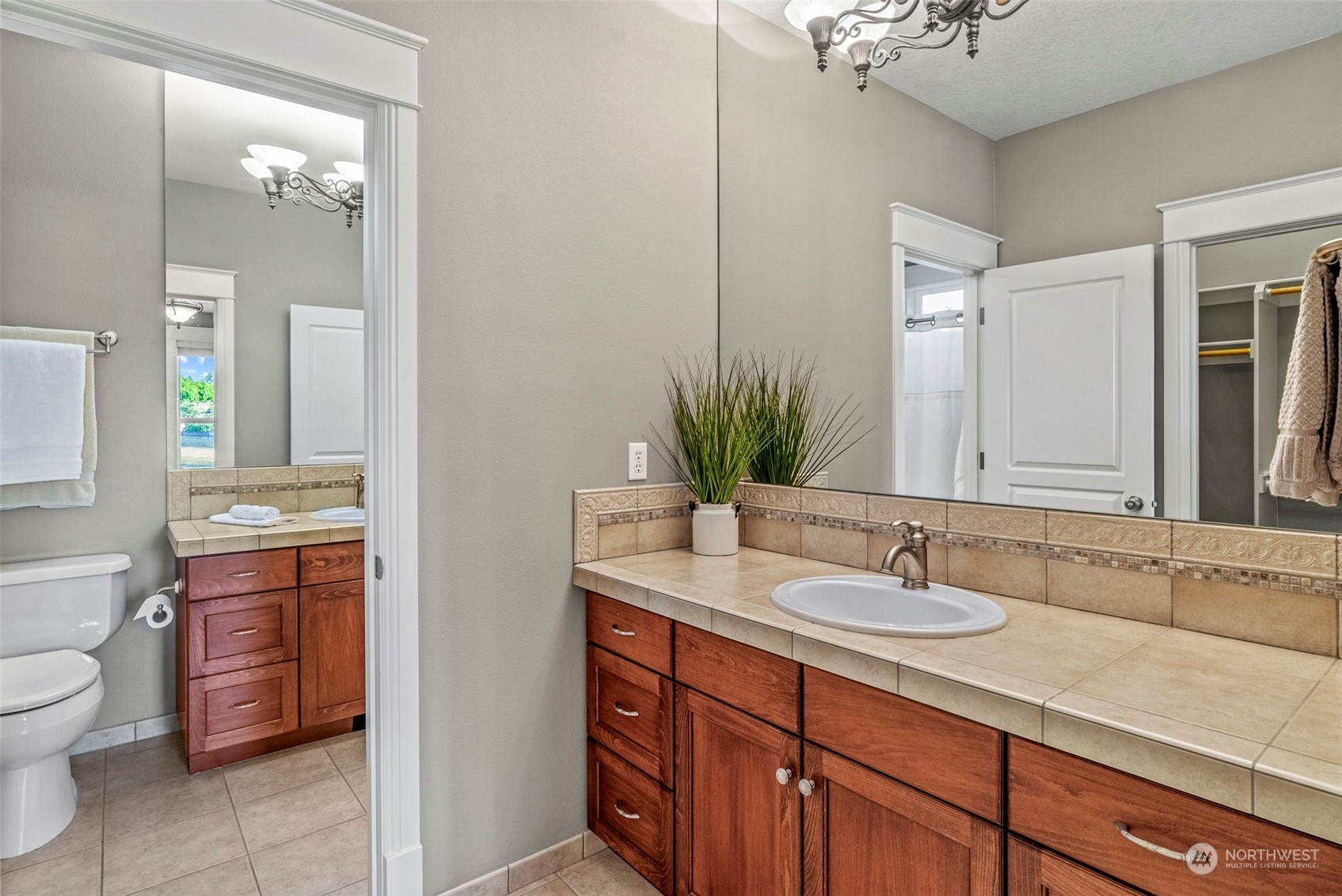 19501 Northwest Krieger Road Ridgefield, WA 98642 - Photo 24 of 38 a bathroom with a sink double vanity and a mirror