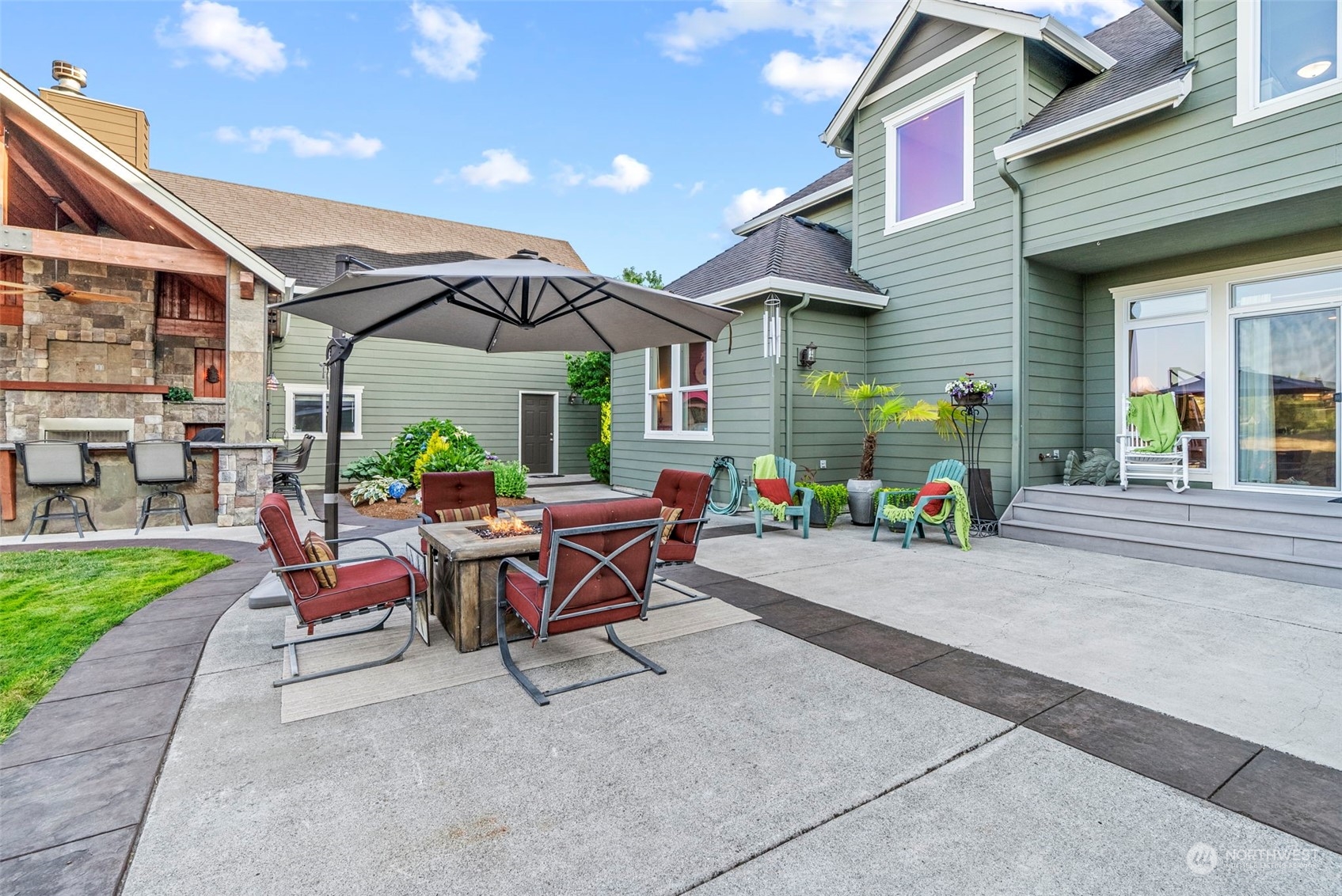 19501 Northwest Krieger Road Ridgefield, WA 98642 - Photo 30 of 38 a patio with a table and chairs