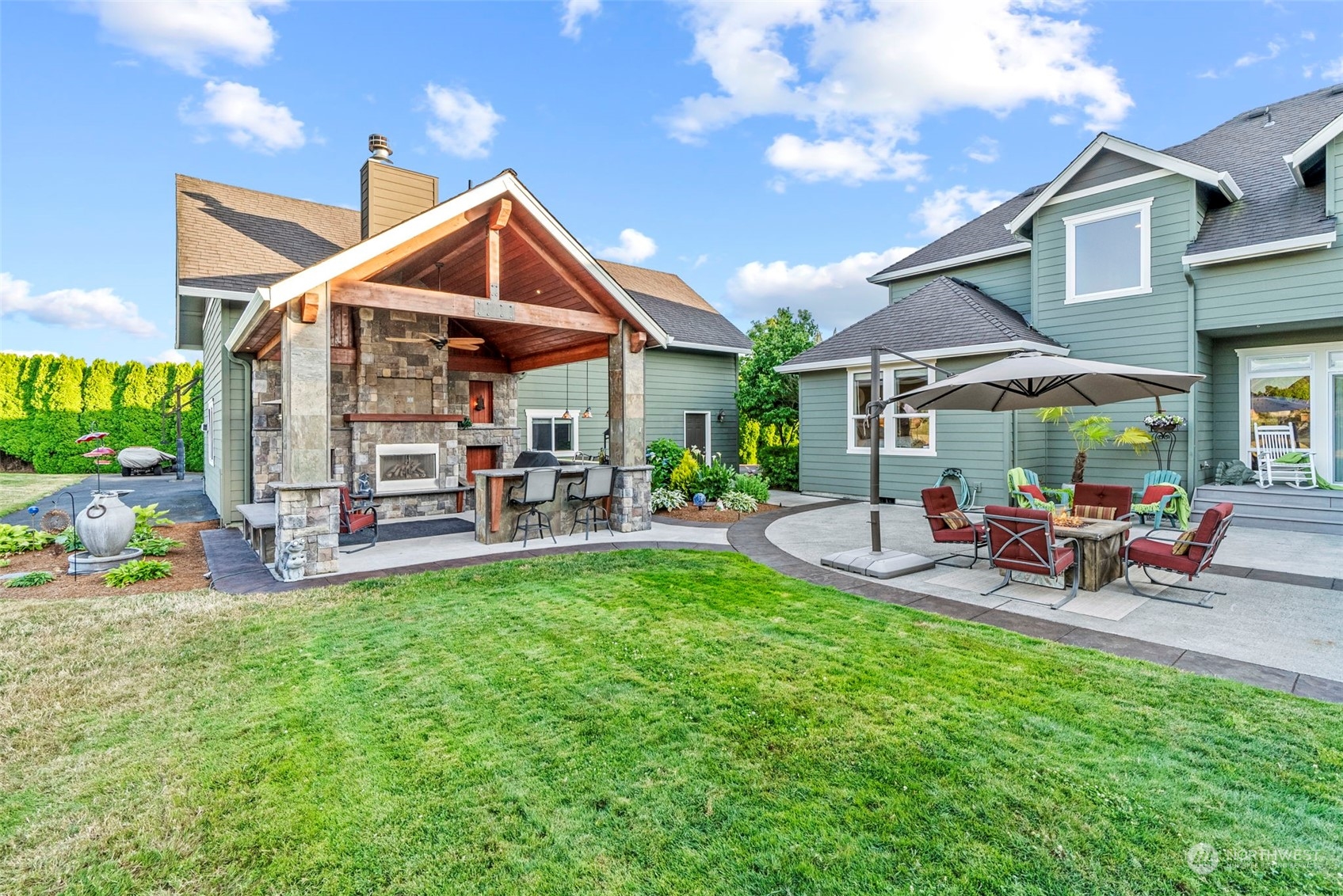 19501 Northwest Krieger Road Ridgefield, WA 98642 - Photo 31 of 38 a view of a house with a yard porch and sitting area