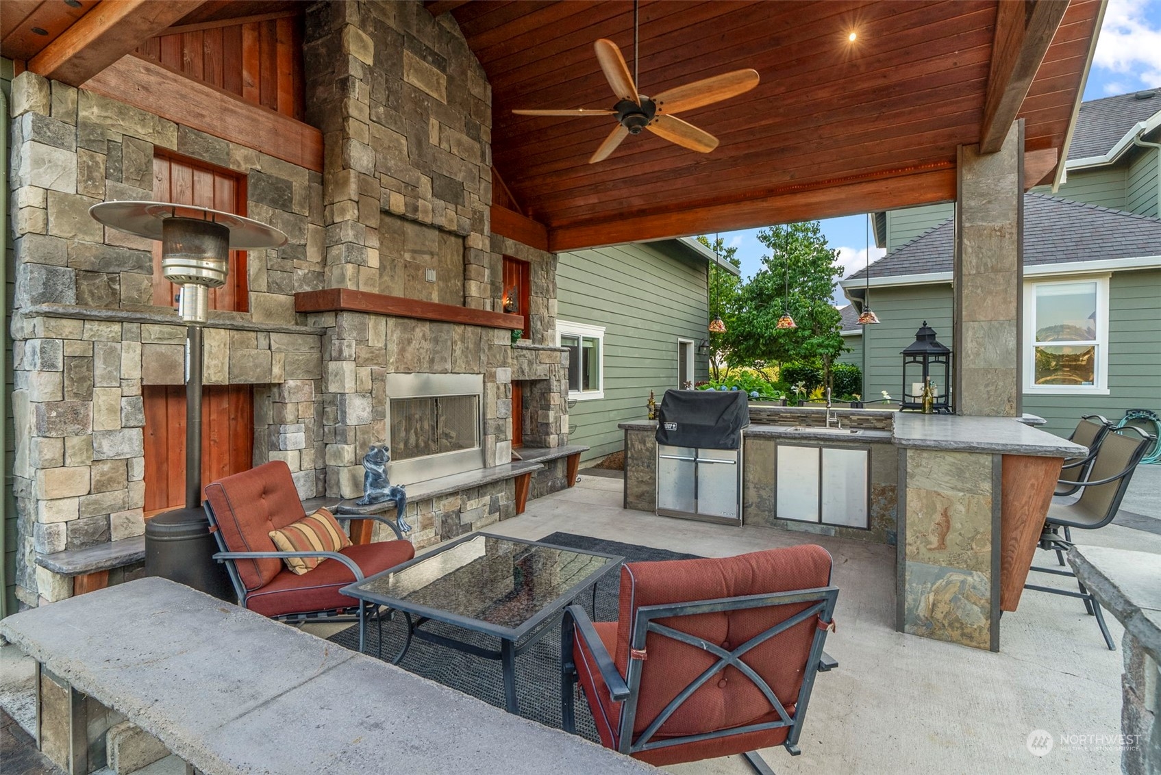 19501 Northwest Krieger Road Ridgefield, WA 98642 - Photo 32 of 38 a outdoor space with patio fireplace and furniture