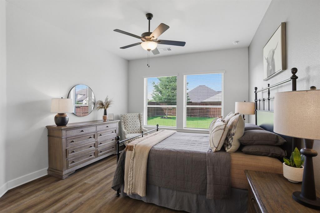1632 Cotton Road Van Alstyne, TX 75495 - Photo 16 of 40 a bed room with a bed and a chandelier