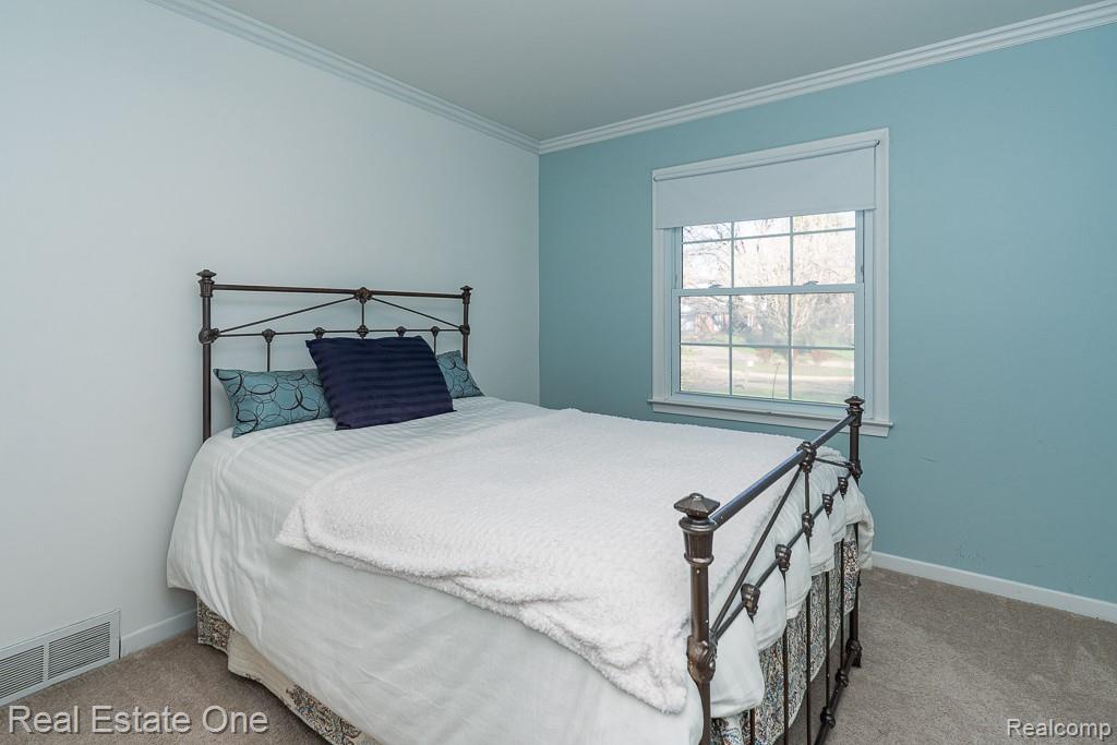 1841 Fair Oak Court Rochester, MI 48309 - Photo 19 of 36 Bedroom featuring light carpet and crown molding