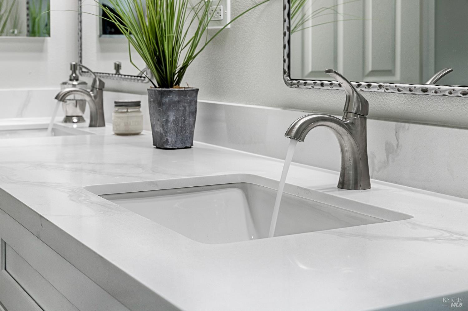 1964 Las Ventanas Drive Santa Rosa, CA 95407 - Photo 23 of 36 a close view of sink a faucet a mirror and a potted plant