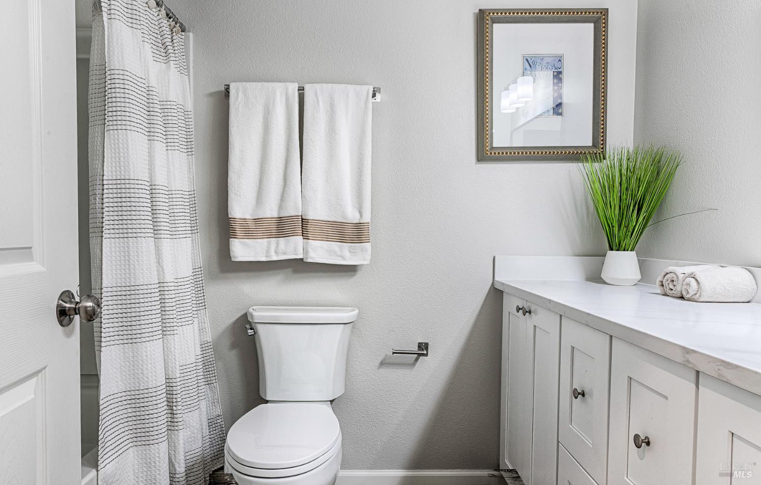 1964 Las Ventanas Drive Santa Rosa, CA 95407 - Photo 25 of 36 a bathroom with a toilet a sink and mirror