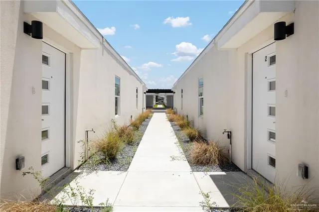 a view of a entrance to house with yard