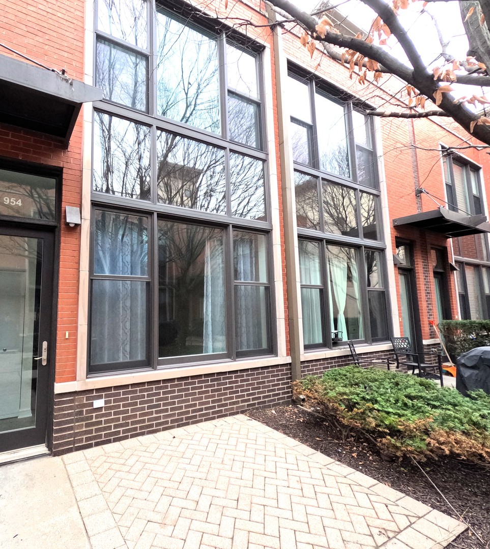Undisclosed Address Chicago, IL 60610 - Photo 1 of 7 a view of a brick house with large windows