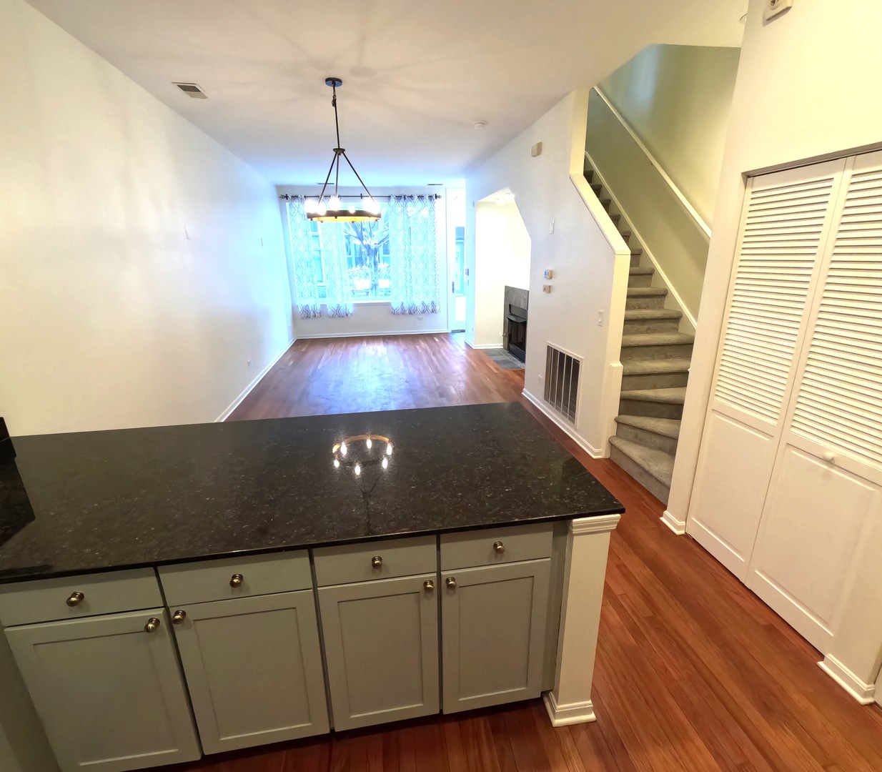 Undisclosed Address Chicago, IL 60610 - Photo 3 of 7 a view of a kitchen with furniture and a ceiling fan