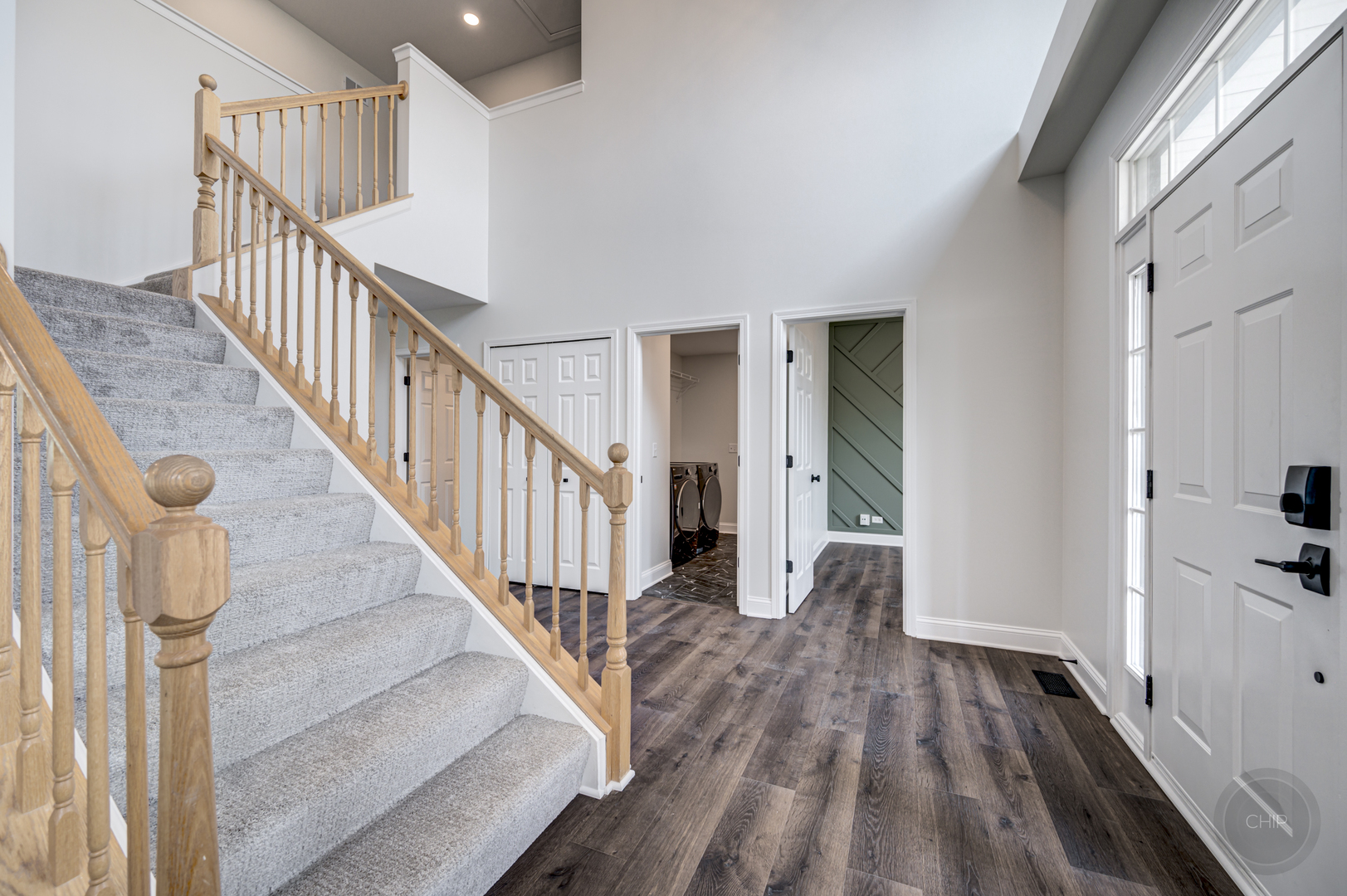 12948 Parterre Place Plainfield, IL 60585 - Photo 4 of 35 a view of entryway and hall with wooden floor