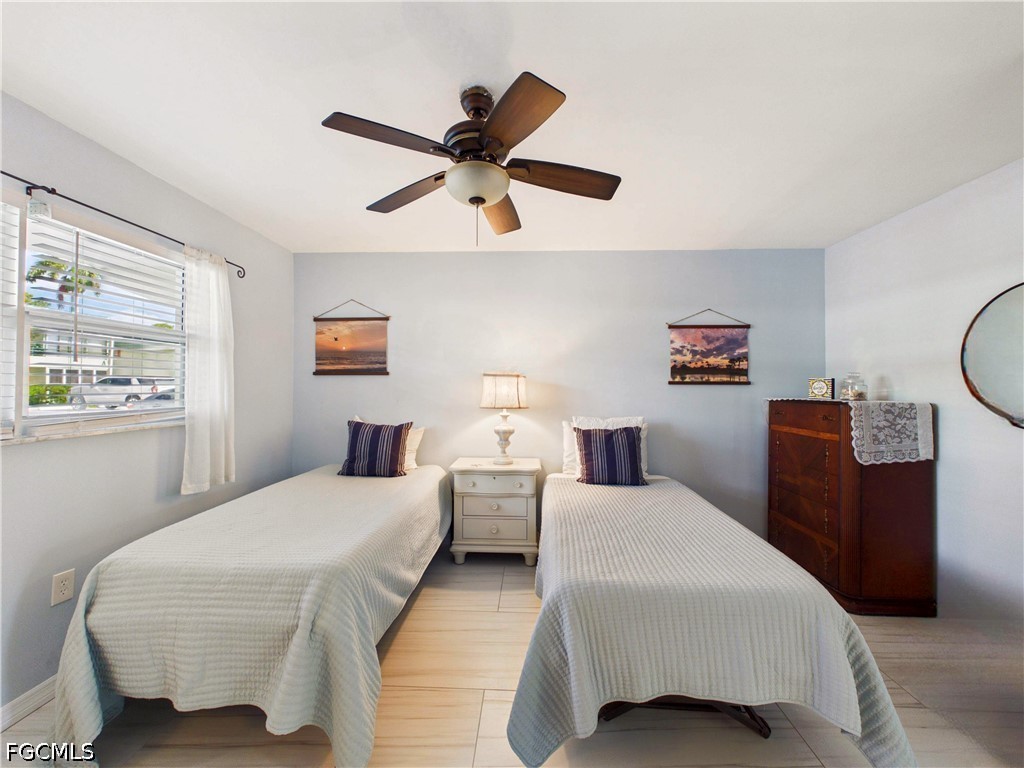 300 Valley Stream Drive, Unit 3D Naples, FL 34113 - Photo 13 of 21 a bedroom with two beds and a window