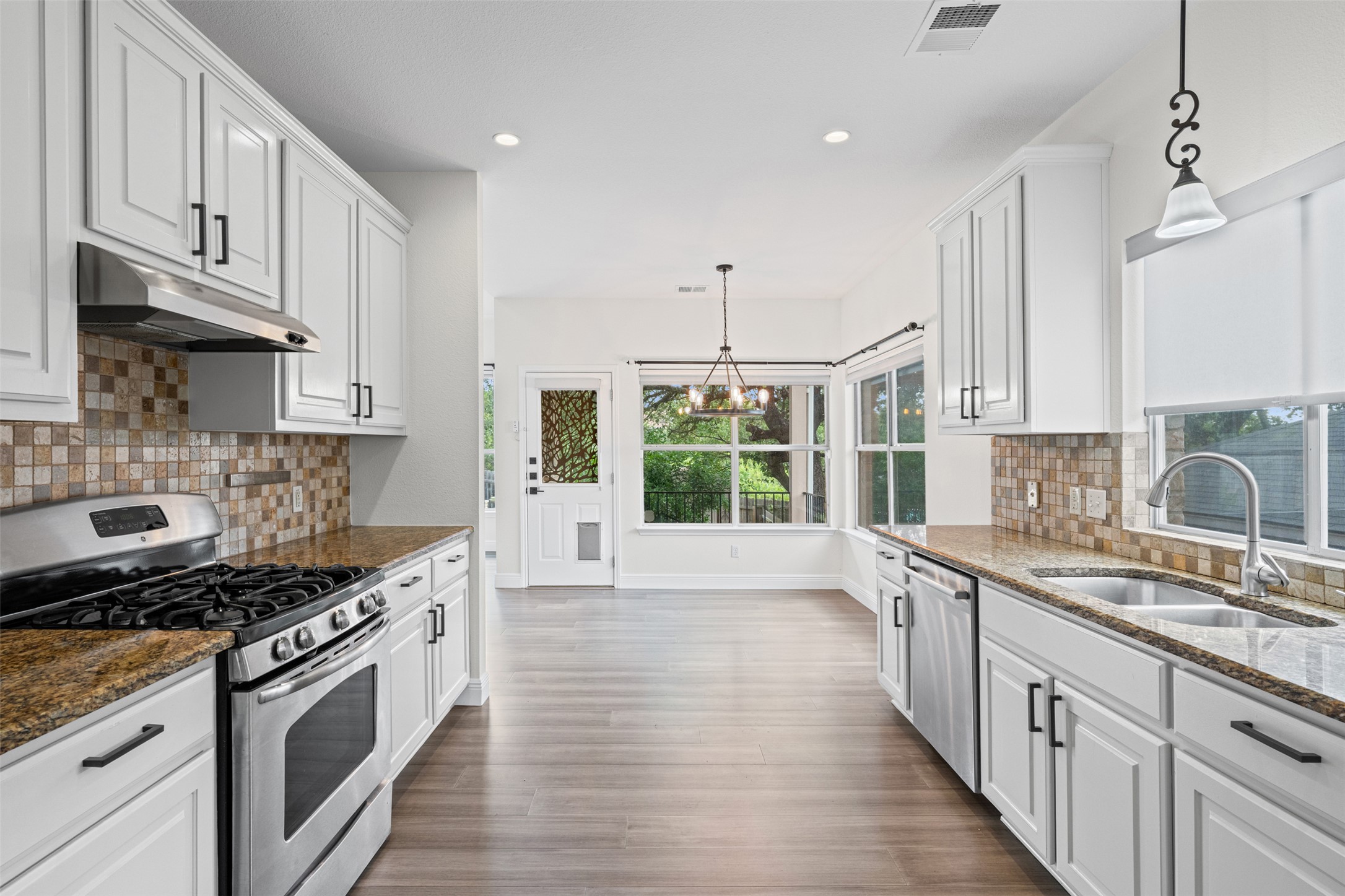 8820 Colberg Drive Austin, TX 78749 - Photo 10 of 35 A well-appointed kitchen features ample counter space and an inviting view to the outdoors.