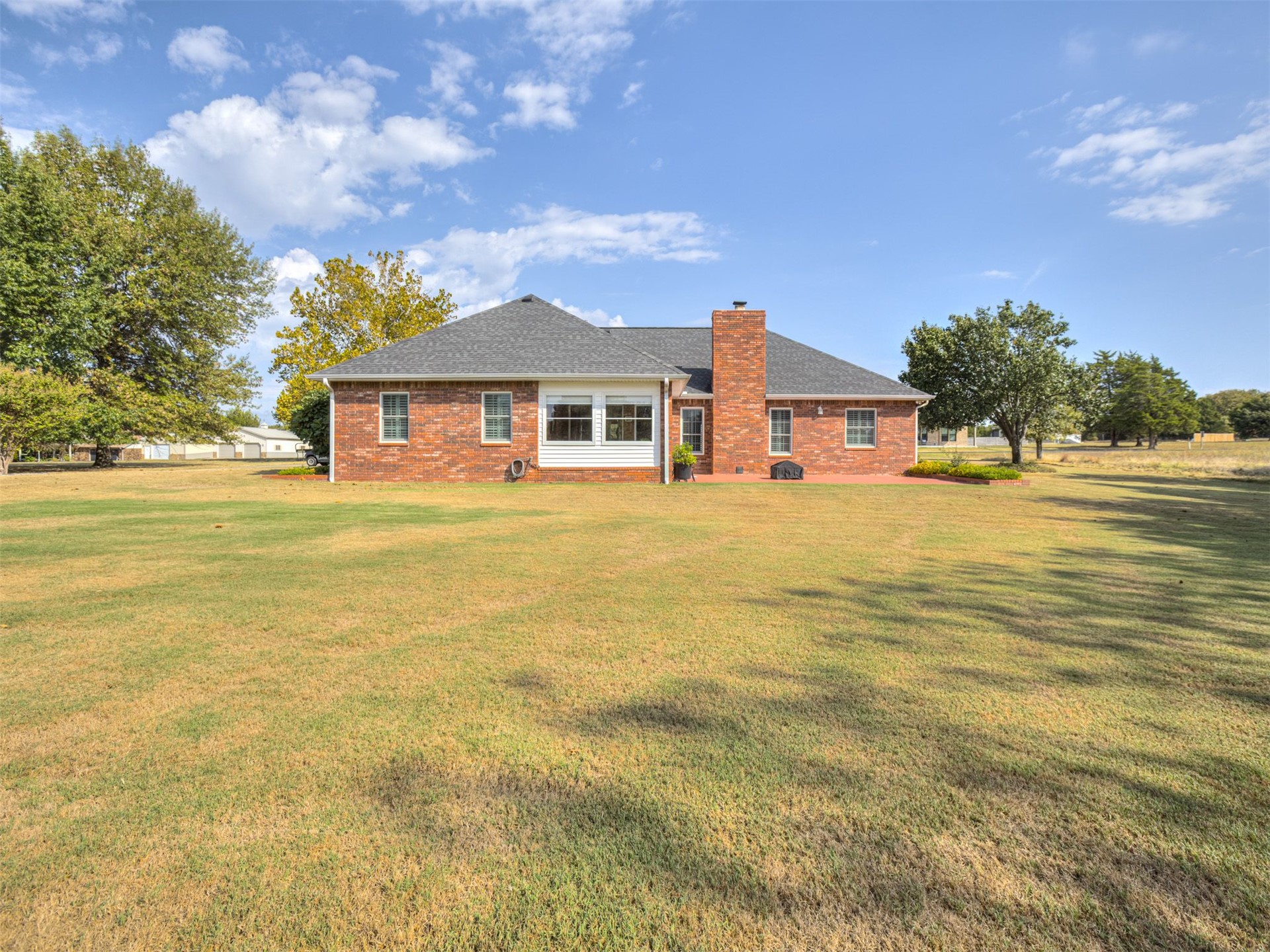 119 Mainsail Road Stigler, OK 74462 - Photo 42 of 52 Brick exterior with a gabled roof and white trim