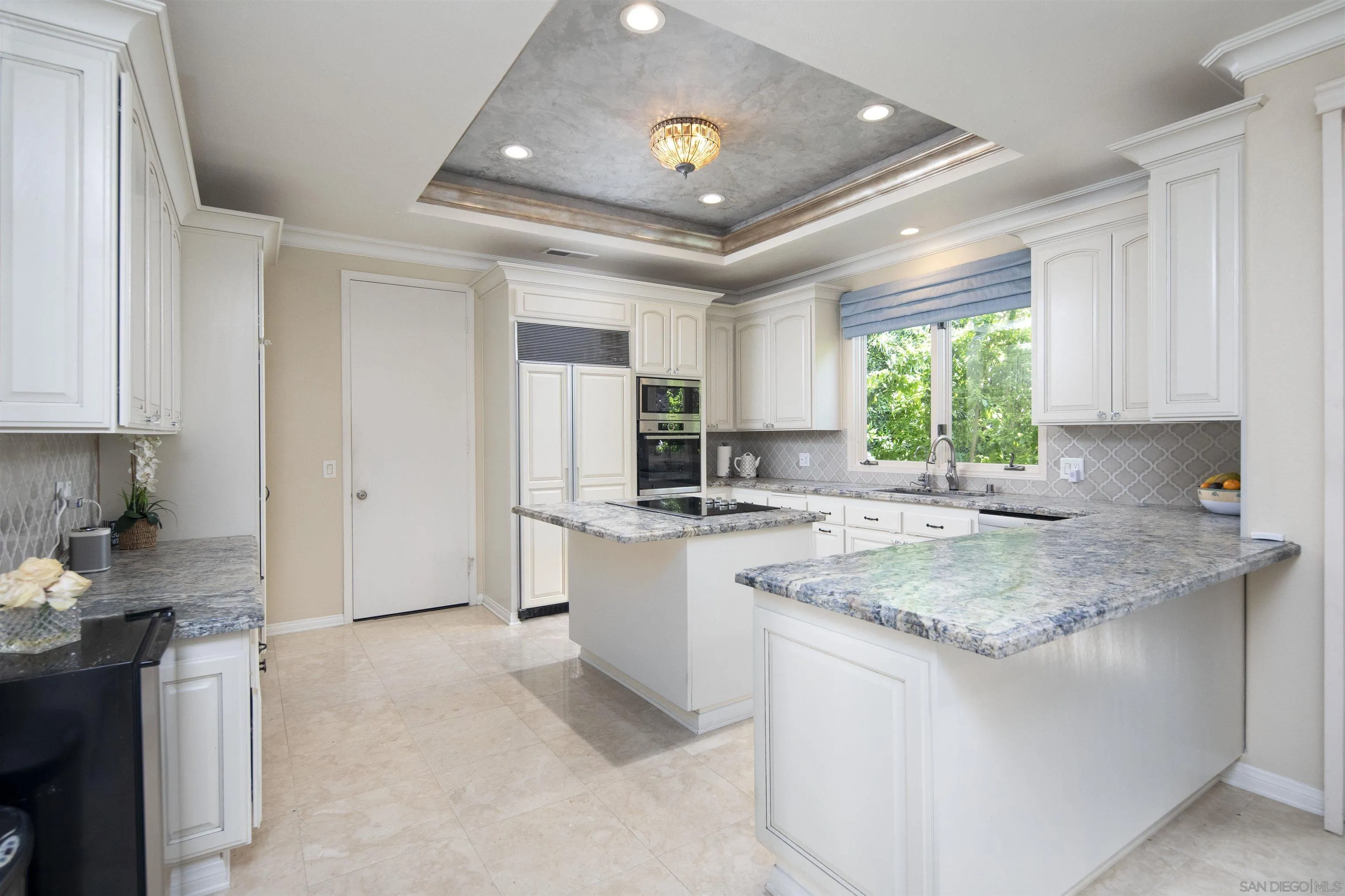 15448 Pimlico Corte Rancho Santa Fe, CA 92067 - Photo 16 of 31 a kitchen with a sink stove and refrigerator