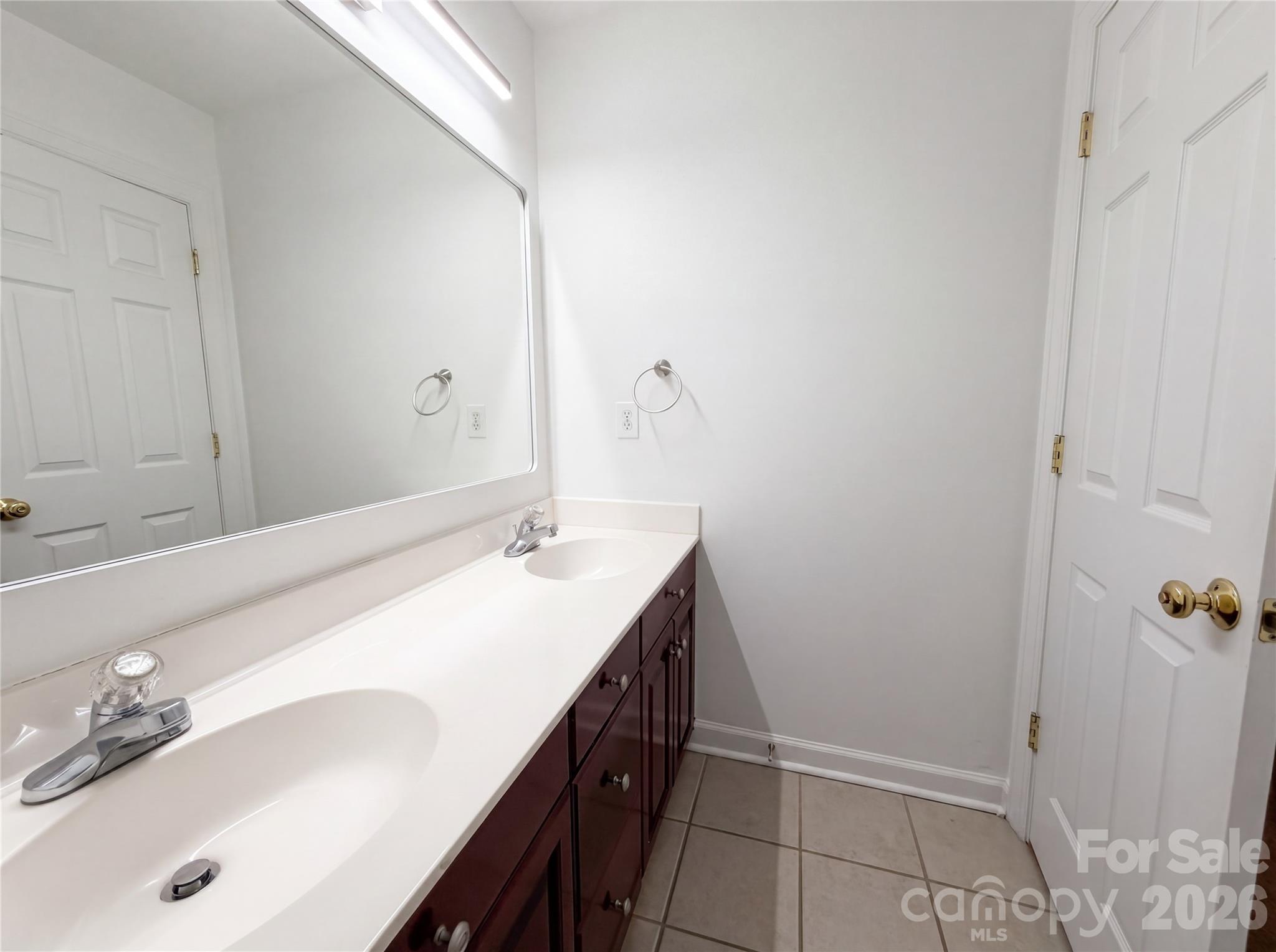12341 Willingdon Road Huntersville, NC 28078 - Photo 14 of 17 a bathroom with a sink and a mirror
