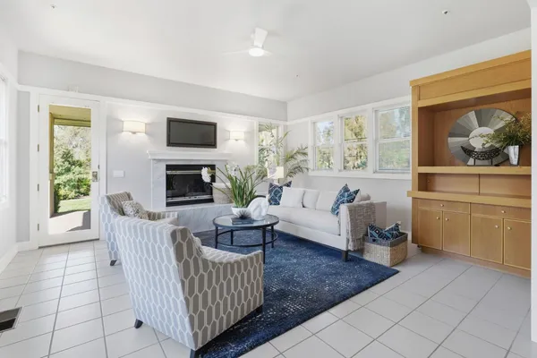 a living room with furniture and a fireplace